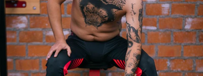 Man sitting on a bench focused before training